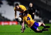 5 February 2022; Clare players Alan Sweeney, left, and Cillian Rouine collide during the Allianz Football League Division 2 match between Cork and Clare at Páirc Ui Chaoimh in Cork. Photo by Ben McShane/Sportsfile