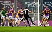 12 February 2022; Eugene Branagan of Kilcoo has a shot on goal blocked by Cian O'Connor of Kilmacud Crokes, in the second half of normal time, during the AIB GAA Football All-Ireland Senior Club Championship Final match between Kilcoo, Down, and Kilmacud Crokes, Dublin, at Croke Park in Dublin. Photo by Piaras Ó Mídheach/Sportsfile