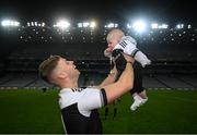 12 February 2022; Jerome Johnston of Kilcoo celebrates with his 5-month-old son Lar after the AIB GAA Football All-Ireland Senior Club Championship Final match between Kilcoo, Down, and Kilmacud Crokes, Dublin, at Croke Park in Dublin. Photo by Stephen McCarthy/Sportsfile