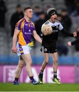 12 February 2022; A Kilcoo supporter celebrates on the pitch after the AIB GAA Football All-Ireland Senior Club Championship Final match between Kilcoo, Down, and Kilmacud Crokes, Dublin, at Croke Park in Dublin. Photo by Stephen McCarthy/Sportsfile