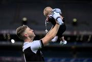 12 February 2022; Jerome Johnston of Kilcoo celebrates with his 5-month-old son Lar after the AIB GAA Football All-Ireland Senior Club Championship Final match between Kilcoo, Down, and Kilmacud Crokes, Dublin, at Croke Park in Dublin. Photo by Stephen McCarthy/Sportsfile