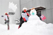 13 February 2022; Volunteers play with a snowman during a break in the Men's Giant Slalom event on day nine of the Beijing 2022 Winter Olympic Games at National Alpine Skiing Centre in Yanqing, China. Photo by Ramsey Cardy/Sportsfile