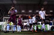 11 February 2022; Gary Deegan of Drogheda United, left, and Sam Bone of Dundalk make their way out before the Jim Malone Cup match between Dundalk and Drogheda United at Oriel Park in Dundalk, Louth. Photo by Ben McShane/Sportsfile