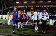 11 February 2022; Drogheda United goalkeeper Sam Long, left, and Patrick Hoban of Dundalk, alongside Killian Moran, make their way out before the Jim Malone Cup match between Dundalk and Drogheda United at Oriel Park in Dundalk, Louth. Photo by Ben McShane/Sportsfile