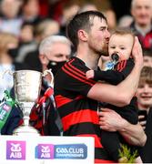 12 February 2022; Ballygunner captain Barry Coughlan kisses his son Connla before lifting the Tommy Moore cup after the AIB GAA Hurling All-Ireland Senior Club Championship Final match between Ballygunner, Waterford, and Shamrocks, Kilkenny, at Croke Park in Dublin. Photo by Stephen McCarthy/Sportsfile