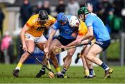12 February 2022; Dublin players Conor Burke, left, and James Madden contest possession against Antrim players Domhnall Nugent and Paddy Burke during the Allianz Hurling League Division 1 Group B match between Antrim and Dublin at Corrigan Park in Belfast. Photo by Ben McShane/Sportsfile