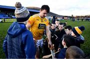 12 February 2022; Domhnall Nugent of Antrim signs hurls for young supporters after the Allianz Hurling League Division 1 Group B match between Antrim and Dublin at Corrigan Park in Belfast. Photo by Ben McShane/Sportsfile