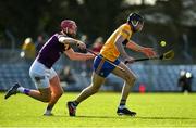 13 February 2022; Cathal Malone of Clare in action against Paudie Foley of Wexford during the Allianz Hurling League Division 1 Group A match between Clare and Wexford at Cusack Park in Ennis, Clare. Photo by Diarmuid Greene/Sportsfile