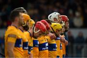 13 February 2022; Clare players including Conor Cleary, white helmet, stand for the national anthem prior to the Allianz Hurling League Division 1 Group A match between Clare and Wexford at Cusack Park in Ennis, Clare. Photo by Diarmuid Greene/Sportsfile