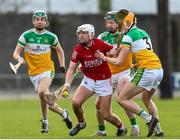 13 February 2022; Luke Meade of Cork in action against Jack Screeney, left, and  Ciaran Burke of Offaly during the Allianz Hurling League Division 1 Group A match between Offaly and Cork at St. Brendan's Park in Birr, Offaly. Photo by Michael P Ryan/Sportsfile
