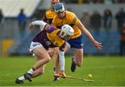 13 February 2022; Oisín Pepper of Wexford in action against Diarmuid Ryan of Clare during the Allianz Hurling League Division 1 Group A match between Clare and Wexford at Cusack Park in Ennis, Clare. Photo by Diarmuid Greene/Sportsfile