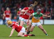13 February 2022; David Nally of Offaly in action against Niall O’ Leary left, and Damien Cahalane of Cork during the Allianz Hurling League Division 1 Group A match between Offaly and Cork at St. Brendan's Park in Birr, Offaly. Photo by Michael P Ryan/Sportsfile