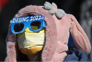 14 February 2022; A supporter, wearing Beijing 2022 glasses, and a face covering, during the Men's Snowboard Big Air Qualification event on day 10 of the Beijing 2022 Winter Olympic Games at Big Air Shougang in Beijing, China. Photo by Ramsey Cardy/Sportsfile