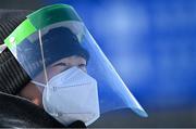 14 February 2022; A member of security, wearing a face mask and shield, during the Men's Snowboard Big Air Qualification event on day 10 of the Beijing 2022 Winter Olympic Games at Big Air Shougang in Beijing, China. Photo by Ramsey Cardy/Sportsfile