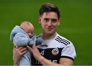 12 February 2022; Aaron Branagan of Kilcoo with his son Leo, age 6 weeks, after the AIB GAA Football All-Ireland Senior Club Championship Final match between Kilcoo, Down, and Kilmacud Crokes, Dublin, at Croke Park in Dublin. Photo by Piaras Ó Mídheach/Sportsfile