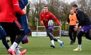 15 February 2022; Chris Farrell, centre, passes to teammate Sahne Daly during Munster rugby squad training at University of Limerick in Limerick. Photo by Eóin Noonan/Sportsfile