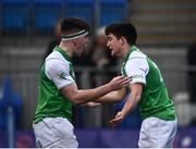 15 February 2022; Oscar O'Neill of Gonzaga, right, is congratulated by team mate Paul Wilson after scoring their side's fifth and winning try during the Bank of Ireland Leinster Rugby Schools Senior Cup 1st Round match between Clongowes Wood College, Kildare and Gonzaga College, Dublin at Energia Park in Dublin. Photo by David Fitzgerald/Sportsfile