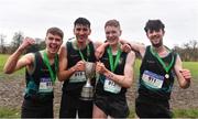 16 February 2022; The Castleknock Community College team, from left, Scott Fagan, Traian Rebegea, Louie Woodger and Finn Woodger, celebrate with the cup after winning the team competition in the senior boys' 4500m during the Irish Life Health Leinster Schools Cross Country Championships at Santry Demesne in Dublin. Photo by Sam Barnes/Sportsfile