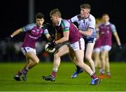16 February 2022; Cathal Donoghue of NUI Galway in action against Connell Dempsey of UL during the Electric Ireland HE GAA Sigerson Cup Final match between NUI Galway and University of Limerick at IT Carlow in Carlow. Photo by Piaras Ó Mídheach/Sportsfile