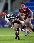 17 February 2022; James Conroy of Cistercian College is tackled by Finn Nolan of Wesley College during the Bank of Ireland Leinster Rugby Schools Senior Cup 1st Round match between Cistercian College, Roscrea and Wesley College at Energia Park in Dublin. Photo by David Fitzgerald/Sportsfile