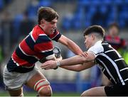 17 February 2022; Oran Handley of Wesley College is tackled by Paddy Sheeran of Cistercian College during the Bank of Ireland Leinster Rugby Schools Senior Cup 1st Round match between Cistercian College, Roscrea and Wesley College at Energia Park in Dublin. Photo by David Fitzgerald/Sportsfile