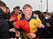 17 February 2022; Rory O’Connor O’Hehir of St Fintan's High School celebrates with supporters after his side's victory in the Bank of Ireland Fr Godfrey Cup Semi-Final match between St Fintan's High School and CBC Monkstown at Clontarf Rugby Club in Dublin. Photo by Seb Daly/Sportsfile