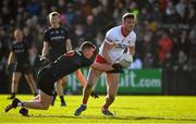 6 February 2022; Brian Kennedy of Tyrone is tackled by Tiernan Kelly of Armagh during the Allianz Football League Division 1 match between Armagh and Tyrone at the Athletic Grounds in Armagh. Photo by Brendan Moran/Sportsfile