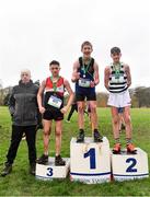 16 February 2022; President of the Irish Schools Athletic Association Billy Delaney, left, with minor boys' 2000m medallists, George Sevastopulo of Mount Temple, gold, Dan Carroll of St Kieran's Kilkenny, silver, and Daniel Downey of St Mary's CBS Portlaoise, bronze, during the Irish Life Health Leinster Schools Cross Country Championships at Santry Demesne in Dublin. Photo by Sam Barnes/Sportsfile