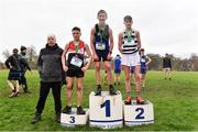 16 February 2022; President of the Irish Schools Athletic Association Billy Delaney, left, with minor boys' 2000m medallists, George Sevastopulo of Mount Temple, gold, Dan Carroll of St Kieran's Kilkenny, silver, and Daniel Downey of St Mary's CBS Portlaoise, bronze, during the Irish Life Health Leinster Schools Cross Country Championships at Santry Demesne in Dublin. Photo by Sam Barnes/Sportsfile