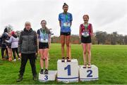 16 February 2022; President of the Irish Schools Athletic Association Billy Delaney, left, with minor girl's 1500m medallists, Sholah Laurane of Green Hills, gold, Eabhadh Multaney-Kelly of Sacred Heart Tullamore, silver, and Clodagh O'Callaghan of Presentation Kilkenny, bronze, during the Irish Life Health Leinster Schools Cross Country Championships at Santry Demesne in Dublin. Photo by Sam Barnes/Sportsfile