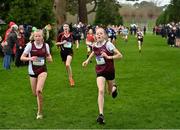 16 February 2022; Laura DeBurca of Loreto Stephens Green, right, and Lily Kate Goold of Loreto Stephens Green, competing in the minor girls' 1500m during the Irish Life Health Leinster Schools Cross Country Championships at Santry Demesne in Dublin. Photo by Sam Barnes/Sportsfile