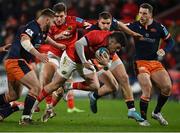 18 February 2022; Calvin Nash of Munster is tackled by Edinburgh players during the United Rugby Championship match between Munster and Edinburgh at Thomond Park in Limerick. Photo by Brendan Moran/Sportsfile