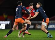 18 February 2022; Dan Goggin of Munster is tackled by Blair Kinghorn, left, and James Lang of Edinburgh during the United Rugby Championship match between Munster and Edinburgh at Thomond Park in Limerick. Photo by Brendan Moran/Sportsfile