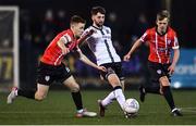 18 February 2022; Joe Adams of Dundalk in action against Brandon Kavanagh, left, and Ciaron Harkin of Derry City during the SSE Airtricity League Premier Division match between Dundalk and Derry City at Oriel Park in Dundalk, Louth. Photo by Ben McShane/Sportsfile