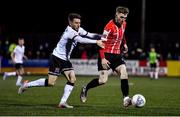 18 February 2022; Jamie McGonigle of Derry City in action against Dan Williams of Dundalk during the SSE Airtricity League Premier Division match between Dundalk and Derry City at Oriel Park in Dundalk, Louth. Photo by Ben McShane/Sportsfile