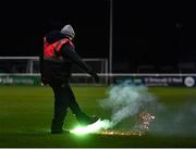 18 February 2022; A security guard removes a flare from the pitch during the SSE Airtricity League First Division match between Bray Wanderers and Cork City at Carlisle Grounds in Bray, Wicklow. Photo by David Fitzgerald/Sportsfile