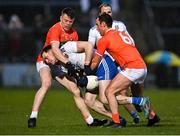 19 February 2022; Niall Kearns of Monaghan is tackled by Aidan Nugent, left, and Niall Rowland of Armagh during the Allianz Football League Division 1 match between Armagh and Monaghan at Athletic Grounds in Armagh. Photo by Piaras Ó Mídheach/Sportsfile