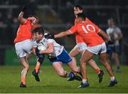 19 February 2022; Andrew Woods of Monaghan in action against Connaire Mackin, left, and Jemar Hall of Armagh during the Allianz Football League Division 1 match between Armagh and Monaghan at Athletic Grounds in Armagh. Photo by Piaras Ó Mídheach/Sportsfile