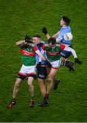 19 February 2022; Dublin players Ciarán Kilkenny and David Byrne contest a high ball with Mayo players Kevin McLoughlin and Diarmuid O’Connor during the Allianz Football League Division 1 match between Dublin and Mayo at Croke Park in Dublin. Photo by Stephen McCarthy/Sportsfile