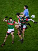 19 February 2022; Dublin players Ciarán Kilkenny and David Byrne contest a high ball with Mayo players Kevin McLoughlin and Diarmuid O’Connor during the Allianz Football League Division 1 match between Dublin and Mayo at Croke Park in Dublin. Photo by Stephen McCarthy/Sportsfile