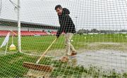 20 February 2022; Groundsman Colum McNicholl clears water from the goal mouth before the Allianz Football League Division 2 match between Derry and Cork at Derry GAA Centre of Excellence in Owenbeg, Derry. Photo by Sam Barnes/Sportsfile