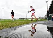 20 February 2022; Benny Heron of Derry makes his way out to the pitch before the Allianz Football League Division 2 match between Derry and Cork at Derry GAA Centre of Excellence in Owenbeg, Derry. Photo by Sam Barnes/Sportsfile