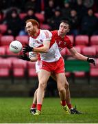 20 February 2022; Conor Glass of Derry in action against Sean Meehan of Cork during the Allianz Football League Division 2 match between Derry and Cork at Derry GAA Centre of Excellence in Owenbeg, Derry. Photo by Sam Barnes/Sportsfile