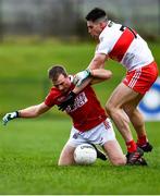 20 February 2022; Conor Doherty of Derry in action against Mattie Taylor of Cork during the Allianz Football League Division 2 match between Derry and Cork at Derry GAA Centre of Excellence in Owenbeg, Derry. Photo by Sam Barnes/Sportsfile