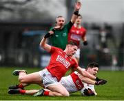 20 February 2022; Padraig McGrogan of Derry in action against Fionn Herlihy of Cork during the Allianz Football League Division 2 match between Derry and Cork at Derry GAA Centre of Excellence in Owenbeg, Derry. Photo by Sam Barnes/Sportsfile