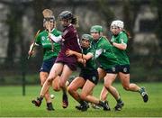20 February 2022; Cliodhna Ni Mhianain of Slaughtneil in action against Tara Kenny and, from left, Joanne Daly, Kate Gallagher and Laura Ward of Sarsfields during the AIB All-Ireland Senior Camogie Club Championship Semi-Final match between Sarsfields and Slaughtneil at Naomh Eanna in Gorey, Wexford. Photo by Matt Browne/Sportsfile