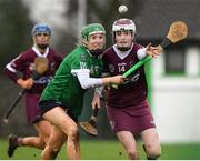 20 February 2022; Sinead Mellon of Slaughtneil in action against Laura Ward of Sarsfields during the AIB All-Ireland Senior Camogie Club Championship Semi-Final match between Sarsfields and Slaughtneil at Naomh Eanna in Gorey, Wexford. Photo by Matt Browne/Sportsfile