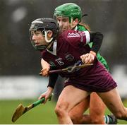 20 February 2022; Therese Mellon of Slaughtneil in action against Reitseal Kelly of Sarsfields during the AIB All-Ireland Senior Camogie Club Championship Semi-Final match between Sarsfields and Slaughtneil at Naomh Eanna in Gorey, Wexford. Photo by Matt Browne/Sportsfile