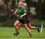 20 February 2022; Orlaith McGrath of Sarsfields in action against Cliona Mulholland of Slaughtneil during the AIB All-Ireland Senior Camogie Club Championship Semi-Final match between Sarsfields and Slaughtneil at Naomh Eanna in Gorey, Wexford. Photo by Matt Browne/Sportsfile
