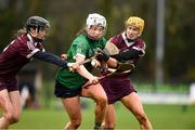20 February 2022; Joanne Daly of Sarsfields in action against Cliodhna Ni Mhianain and Tina Bradley of Slaughtneil during the AIB All-Ireland Senior Camogie Club Championship Semi-Final match between Sarsfields and Slaughtneil at Naomh Eanna in Gorey, Wexford. Photo by Matt Browne/Sportsfile